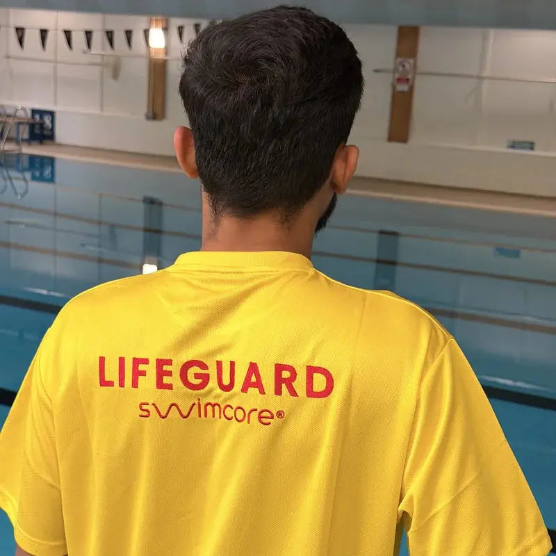 Back of the yellow lifeguard t-shirt with embroidered red LIFEGUARD lettering