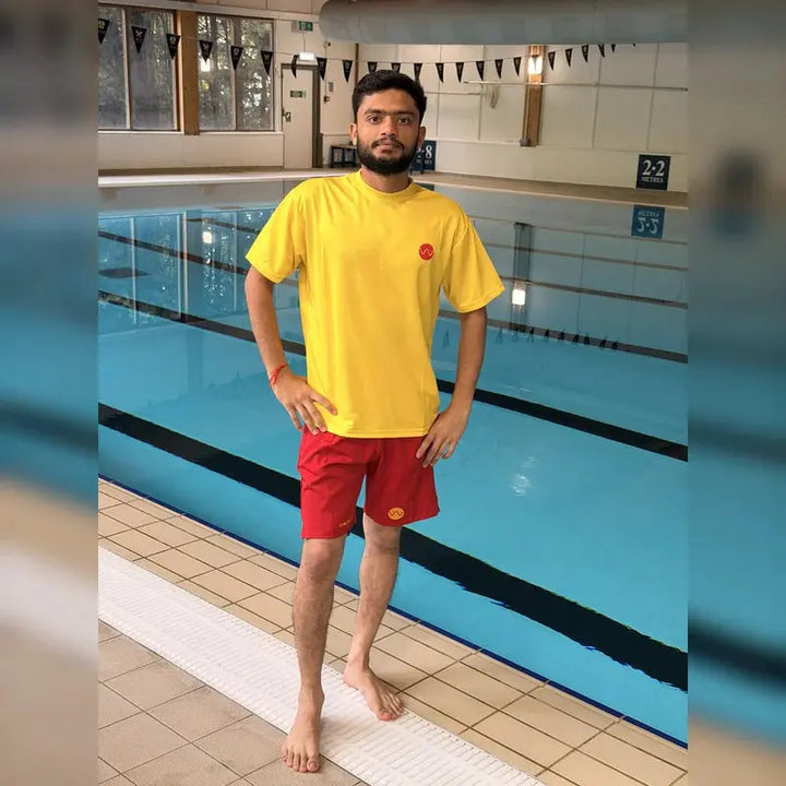 Full lifeguard uniform: yellow embroidered t-shirt and red lifeguard shorts